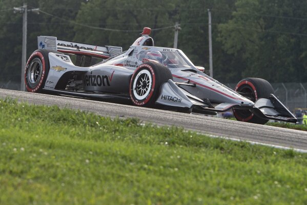 Will Power, of Australia, exits a turn during the IndyCar Series auto race at Mid-Ohio Sports Car Course, Saturday, Sept. 12, 2020, in Lexington, Ohio. (AP Photo/Phil Long)