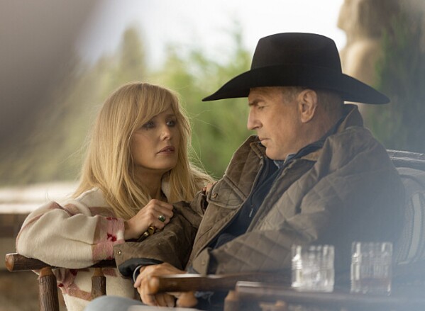 This image released by Paramount Network shows Kelly Reilly, left, and Kevin Costner in a scene from "Yellowstone." (Paramount Network via AP)