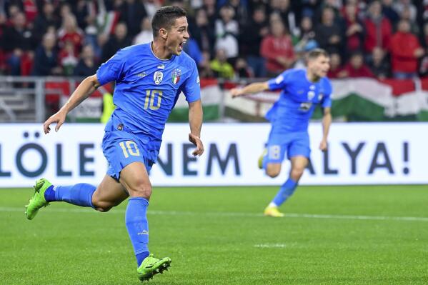 Italy's Giacomo Raspadori celebrates scoring a goal, during the UEFA Nations League soccer match between Hungary and Italy, at the Puskas Arena in Budapest, Hungary, Monday, Sept. 26, 2022. (Zsolt Szigetvary/MTI via AP)