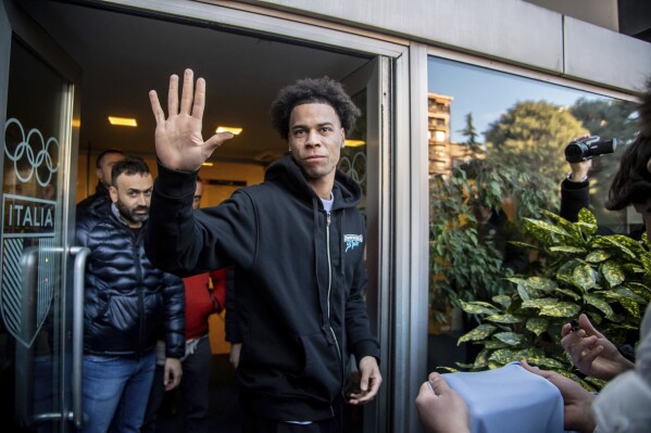 Trevor Buchanan leaves the Olympic Committee in Milan, Italy, after receiving eligibility for sports activities Thursday, Jan. 4, 2024. The Canadian national is expected to sign for Inter later today. (Claudio Furlan/LaPresse via AP)