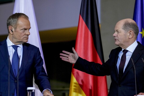 German Chancellor Olaf Scholz, right, and Poland's Prime Minister Donald Tusk attend a press conference in Berlin, Germany, Monday, Feb.12, 2024. (AP Photo/Ebrahim Noroozi)