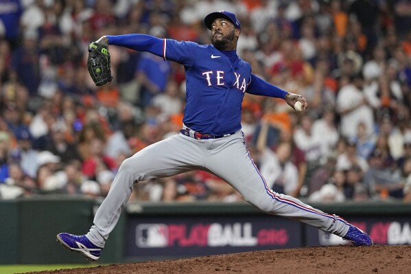 FILE - Texas Rangers relief pitcher Aroldis Chapman throws during the seventh inning of Game 7 of the baseball AL Championship Series against the Houston Astros, Oct. 23, 2023, in Houston. The Pittsburgh Pirates have bolstered the back end of their bullpen, agreeing to terms with seven-time All-Star reliever Aroldis Chapman on a one-year deal worth $10.5 million, Wednesday, Jan. 31, 2024. The deal is pending completion of a physical, a person familiar with the agreement told The Associated Press.(AP Photo/David J. Phillip, File)