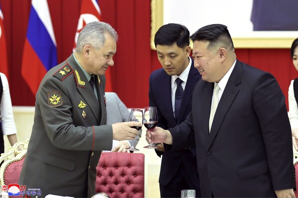 FILE - In this photo provided by the North Korean government, North Korean leader Kim Jong Un, right, and Russian Defense Minister Sergei Shoigu, left, toast at a banquet hall of the ruling Workers' Party's headquarters in Pyongyang, North Korea on July 27, 2023. Independent journalists were not given access to cover the event depicted in this image distributed by the North Korean government. The content of this image is as provided and cannot be independently verified. Korean language watermark on image as provided by source reads: 