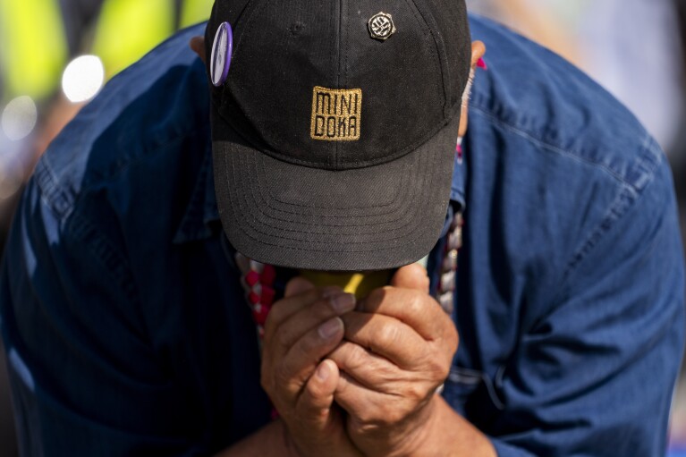 Minidoka survivor Jerry Arai bows his head in a prayer during a closing ceremony for the Minidoka Pilgrimage at the Minidoka National Historic Site, Sunday, July 9, 2023, in Jerome, Idaho. (AP Photo/Lindsey Wasson)