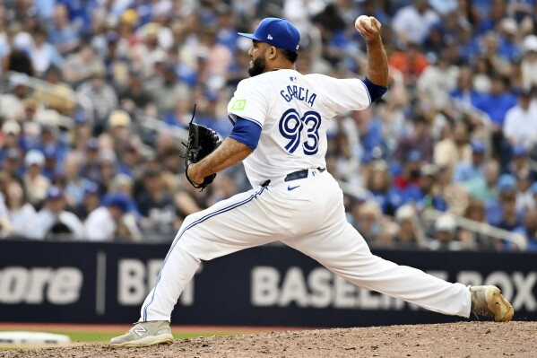 Toronto Blue Jays relief pitcher Yimi Garcia (93) throws to a Detroit Tigers batter in the ninth inning of a baseball game in Toronto, Saturday, July 20, 2024. (Jon Blacker/The Canadian Press via ĢӰԺ)