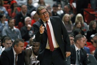 FILE - In this Thursday, Nov. 21, 2019 file photo, Texas Tech assistant coach Mark Adams yells out to the players during the first half of an NCAA college basketball game against Tennessee State in Lubbock, Texas. Texas Tech is promoting top assistant and school alumnus Mark Adams to replace Chris Beard as head coach. Kirby Hocutt, Tech's athletic director, sent a tweet Monday night, April 5, 2021 with a picture of him with Adams that read: “Red Raider Nation _ your Head Men’s Basketball Coach, Mark Adams.” (AP Photo/Brad Tollefson, File)