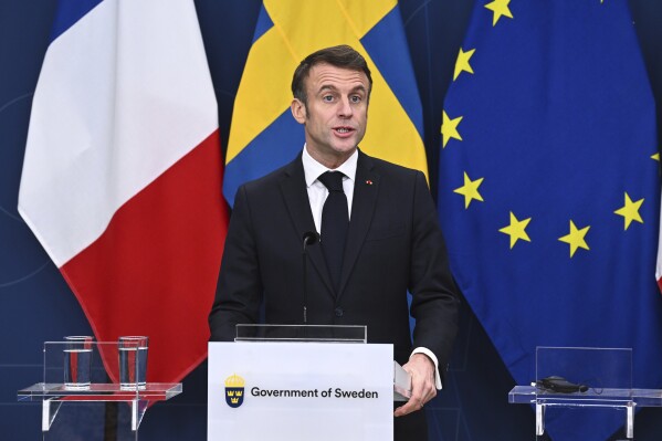 French President Emmanuel Macron holds a press conference with Sweden's Prime Minister Ulf Kristersson in Stockholm, Sweden, Tuesday Jan. 30, 2024. France’s President Emmanuel Macron started a two-day state visit in Stockholm during which he will meet Swedish prime minister, Ulf Kristersson, and the country’s monarch, King Carl XVI Gustaf. (Claudio Bresciani/TT via AP)