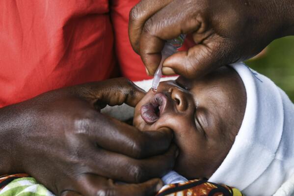 FILE - A baby receives a polio vaccine during the Malawi Polio Vaccination Campaign Launch in Lilongwe, Malawi, on March 20, 2022. In neighbouring Mozambique, health authorities declared Wednesday May 18, 2022, an outbreak of wild poliovirus after confirming that a child in the country's northeastern Tete province had contracted the disease. (AP Photo/Thoko Chikondi, File)