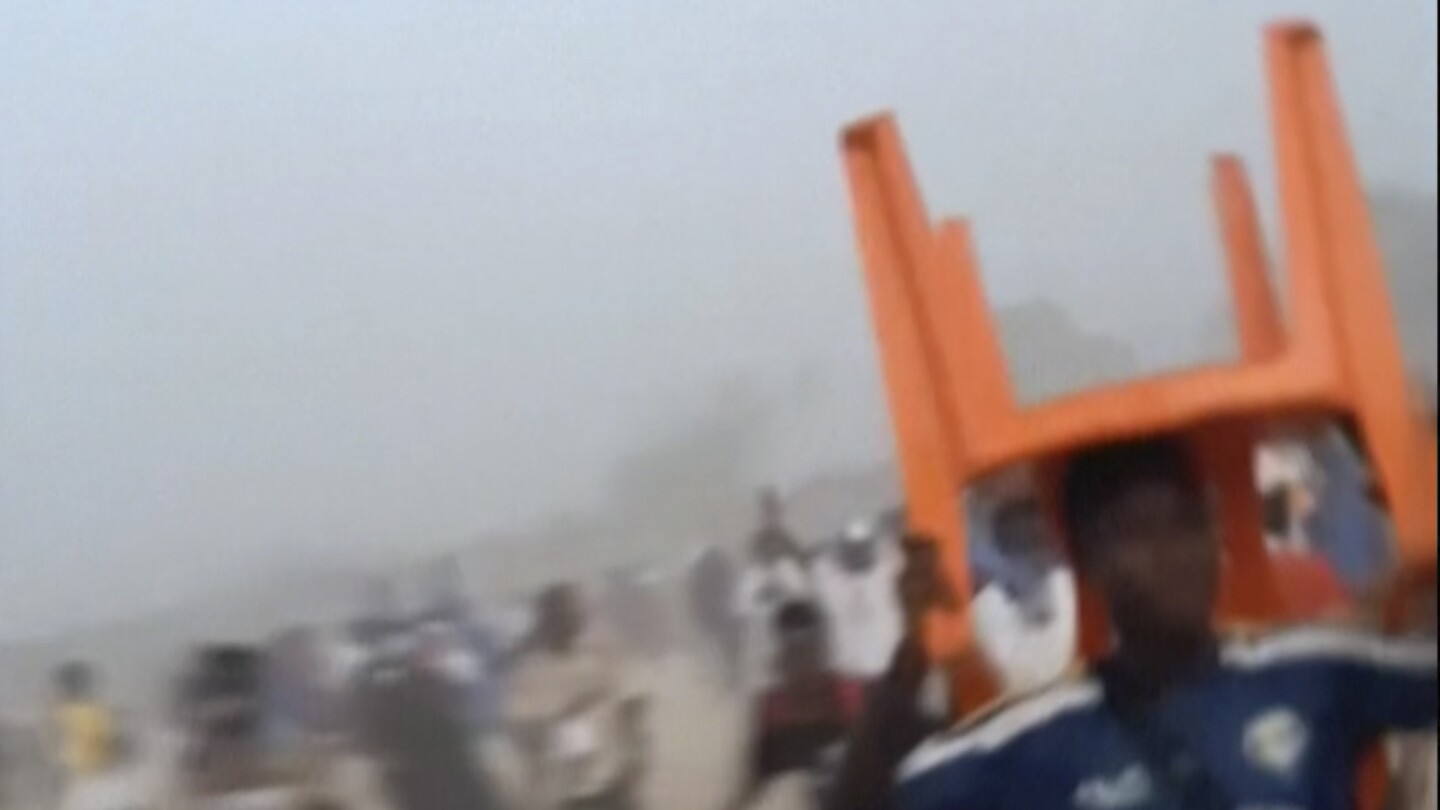 56 other people killed in stampede following clashes at a Guinea football fit, government say