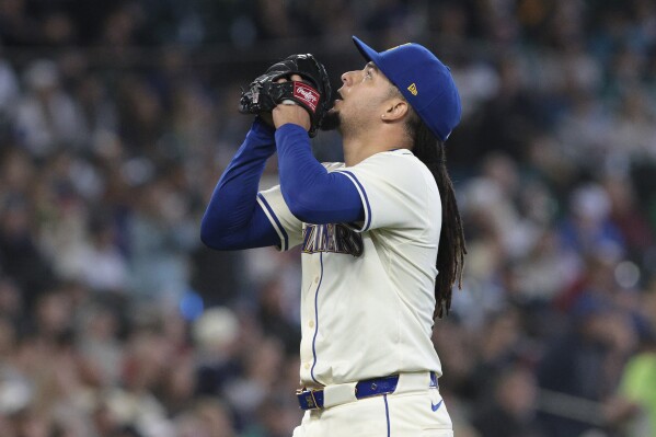 Seattle Mariners starting pitcher Luis Castillo looks up after the third out during the seventh inning of a baseball game against the Los Angeles Angels, Sunday, June 2, 2024, in Seattle. (AP Photo/Jason Redmond)