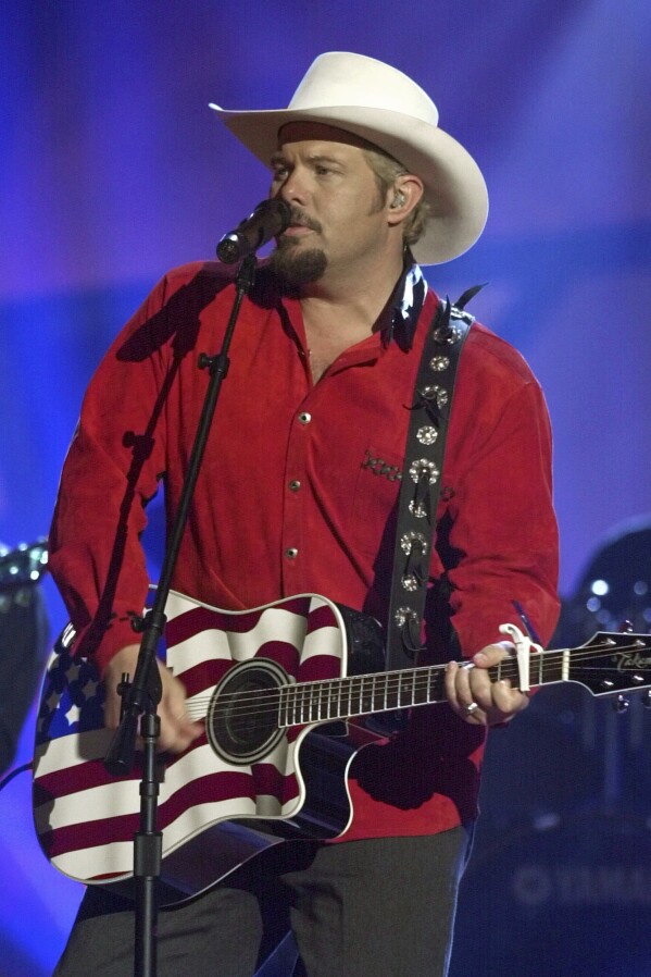 File - Country singer Toby Keith performs his song "Courtesy of The Red, White and Blue (The Angry American)," On June 12, 2002 in Nashville, Tennessee.  Keith, who died of cancer on Monday, February 5, 2024, at the age of 62, is being celebrated for his vast catalog of songs.  But his 2002 track 