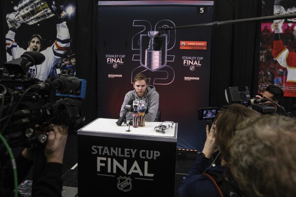 Edmonton Oilers' Connor McDavid (97) speaks to media during a news conference, Tuesday, June 3, 2025, in Edmonton, Alberta, ahead of Game 1 of the NHL hockey Stanley Cup final series against the Florida Panthers. (Jason Franson/The Canadian Press via AP)