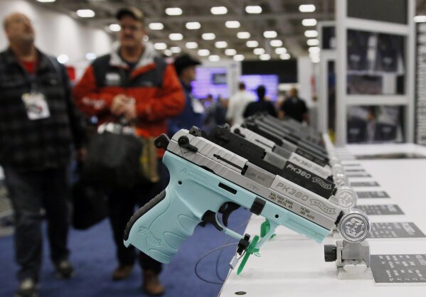 
              FILE - In this May 4, 2018, file photo, handguns are on display at the NRA convention in Dallas. The National Rifle Association is gathering for its 148th annual meeting beginning Thursday, April 25, 2019, in Indianapolis. (AP Photo/Sue Ogrocki, File)
            