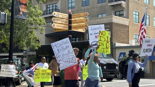 Protestors opposed to a new law cracking down on employers who hire immigrants in the country illegally march to the Florida Capitol, Friday, June 30, 2023, in Tallahassee, Fla. (AP Photo/Brendan Farrington).