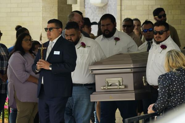 Pallbearers carry the casket of Amerie Jo Garza following funeral services at Sacred Heart Catholic Church, Tuesday, May 31, 2022, in Uvalde, Texas. Garza was killed in last week's elementary school shooting, (AP Photo/Eric Gay)