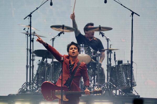 Billie Joe Armstrong, center, and Tre' Cool, top, of Green Day perform on day three of the Bud Light Super Bowl Music Fest, Saturday, Feb. 12, 2022, at Crypto.com Arena in Los Angeles. (AP Photo/Chris Pizzello)
