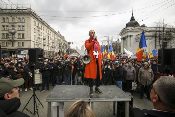 Marina Tauber the vice-president of Moldova's Russia-friendly Shor Party speaks during a protest initiated by the Movement for the People and members of Moldova's Russia-friendly Shor Party, against the pro-Western government and low living standards, in Chisinau, Moldova, Tuesday, Feb. 28, 2023. Thousands of protesters returned to Moldova's capital Tuesday to demand that the country'snew pro-Western governmentfully subsidize citizens' winter energy bills amid skyrocketing inflation. (AP Photo/Aurel Obreja)