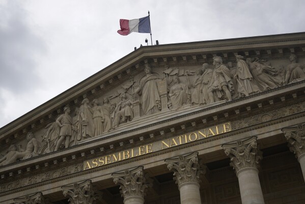 The French flag flies atop the French National Meeting Wednesday, July 3, 2024 in Paris. French President Emmanuel Macron dissolved the National Meeting and known as the snap election on June 9 after a stinging defeat by the hands of the National Rally in French vote casting for the European Parliament. The 2nd spherical of the legislative will take effect Sunday July 7. (AP Photo/Thibault Camus)