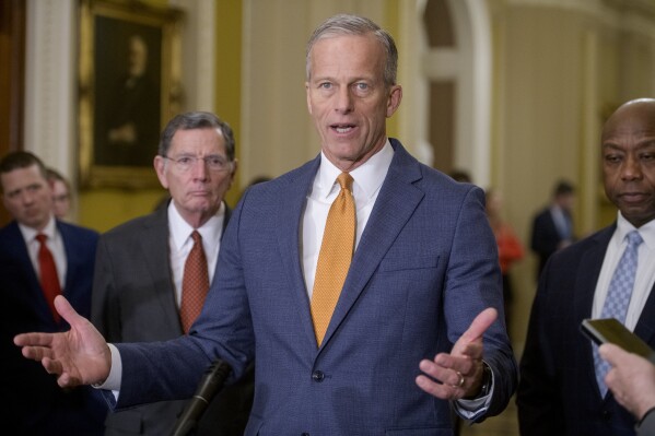 Senate Majority Leader John Thune, R-S.D., center, is joined by Sen. John Barrasso, R-Wyo., left, and Sen. Tim Scott, R-S.C., right, during the Senate Republican policy luncheon press conference at the Capitol, Tuesday, Feb. 4, 2025, in Washington. (AP Photo/Rod Lamkey, Jr.)
