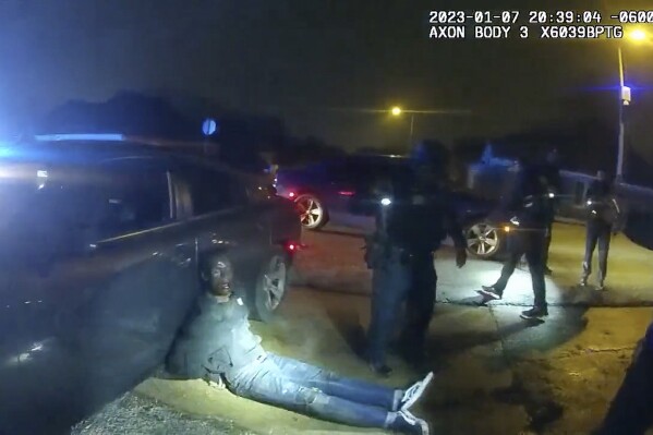 FILE - In this image taken from video released on Jan. 27, 2023, by the city of Memphis, Tenn., Tyre Nichols leans against a car after a brutal attack by five Memphis police officers on Jan. 7, in Memphis. A judge on Thursday, Feb. 8, 2024, pushed back for four months the federal court trial of four former Memphis police officers charged with civil rights violations in the beating death of Nichols. (City of Memphis via AP, File)