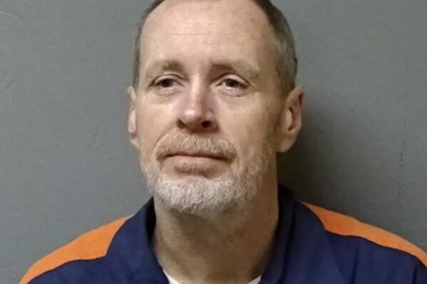 In this image provided by the Michigan Department of Corrections shows inmate Lawrence John Delisle, convicted of driving into the Detroit River and drowning his four children in 1989. Delisle pleaded with the Michigan parole board for a shorter prison sentence Thursday, March 21, 2024, insisting the deaths were an accident. DeLisle, 63, said during a public board hearing that a leg cramp caused him to hit the gas pedal and plunge the vehicle into the river in Wyandotte. (Michigan Department of Corrections via AP)