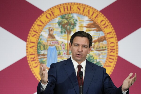 FILE - Florida Gov. Ron DeSantis speaks during a news conference, May 9, 2023, in Miami. On Saturday, Aug. 26, DeSantis declared a state of emergency for most of Florida's Gulf coast as forecasters say a weather system off the coast of Mexico could soon become a tropical storm and start moving toward the area. (AP Photo/Rebecca Blackwell, File)