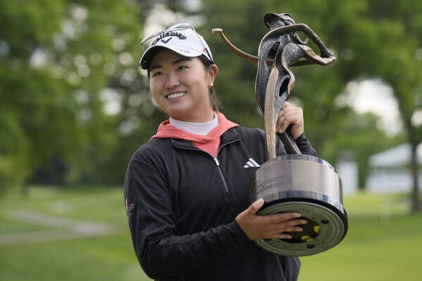 Rose Zhang poses for photos after winning the LPGA Cognizant Founders Cup golf tournament, Sunday, May 12, 2024, in Clifton, N.J. (AP Photo/Seth Wenig)
