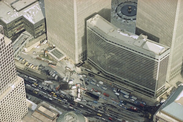 Manhattan's West Street is jammed with police and emergency service vehicles in the aftermath of yesterday's explosion that rocked New York's APTrade Center's twin towers and the Vista Hotel, foreground right, Feb. 27, 1993, causing evacuation of the financial center.  Officials all but confirmed that a bomb caused the huge blast that left at least five people dead and injured hundreds.  (APPhoto/Mike Derer)