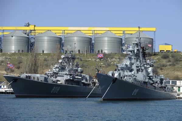 FILE - Russian Black Sea fleet ships are anchored in one of the bays of Sevastopol, Crimea, March 31, 2014. Successful Ukrainian drone and missile strikes have provided a major morale boost for Kyiv at a time when its undermanned and under-gunned forces are facing Russian attacks along the more than 1,000-kilometer front line. Challenging Russia’s naval superiority also has helped create more favorable conditions for Ukrainian grain exports and other shipments from the country’s Black Sea ports. (AP Photo/File)