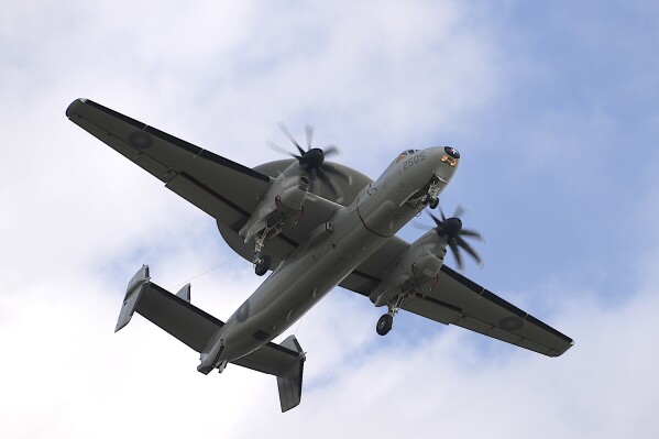An E-2 early warning aircraft flies near an airbase in southern Taiwan's Pingtung county on Tuesday, Jan. 30, 2024. Taiwan is holding spring military drills following its recent presidential election and amid threats from China, which claims the island as its own territory that it is determined to annex, possibly by force.(AP Photo/Johnson Lai)