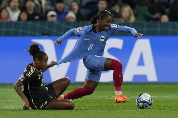 France's Grace Geyoro has her shirt pulled back by Jamaica's Atlanta Primus during the Women's World Cup Group F soccer match between France and Jamaica at the Sydney Football Stadium in Sydney, Australia, Sunday, July 23, 2023. (AP Photo/Mark Baker)