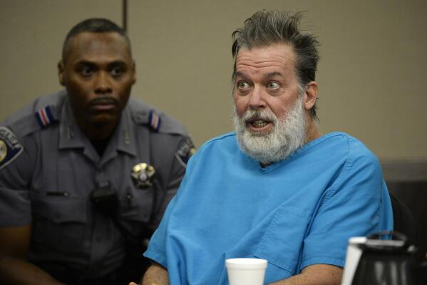 FILE - Robert Dear talks to Judge Gilbert Martinez during a court appearance in Colorado Springs, Colo., on Dec. 9, 2015. A federal judge ruled Monday, Sept. 19, 2022, that Dear, a mentally ill man charged with killing three people at a Colorado Planned Parenthood clinic in 2015 because it offered abortion services, can be forcibly medicated to try to make him competent to stand trial. The prosecution of Dear has stalled because he has been repeatedly found mentally incompetent since his arrest and has refused to take anti-psychotic medication for delusional disorder. (Andy Cross/The Denver Post via AP, File)