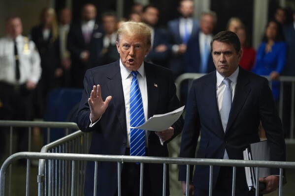 Former President Donald Trump speaks to members of the media upon arriving at Manhattan criminal court, Monday, May 13, 2024, in New York. (AP Photo/Seth Wenig, Pool)