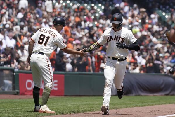 Mitch Haniger of the San Francisco Giants rounds the bases after