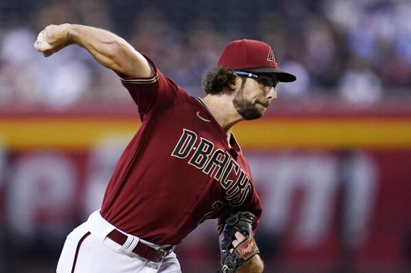 Arizona Diamondbacks starting pitcher Zac Gallen throws against the Milwaukee Brewers during the first inning of a baseball game Sunday, Sept. 4, 2022, in Phoenix. (AP Photo/Ross D. Franklin)