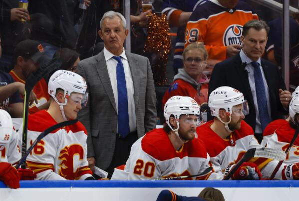 Calgary Flames head coach Darryl Sutter looks on from the bench during the second period of an NHL hockey Stanley Cup second-round playoff series game in Edmonton, Alberta, Sunday, May 22, 2022. (Jeff McIntosh/The Canadian Press via AP)