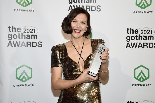 Maggie Gyllenhaal poses with the best screenplay award in the winners room at the Gotham Awards at Cipriani Wall Street on Monday, Nov. 29, 2021, in New York. (Photo by Evan Agostini/Invision/AP)