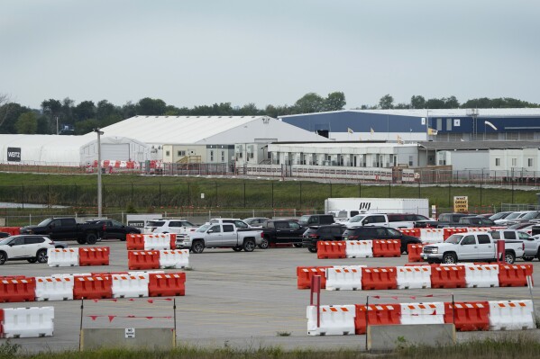 A Microsoft data center is seen near Interstate 35, Tuesday, Sept. 5, 2023, in West Des Moines, Iowa. Microsoft has been amassing a cluster of data centers to power its cloud computing services for more than a decade. Its fourth and fifth data centers in the city are due to open later this year. (AP Photo/Charlie Neibergall)