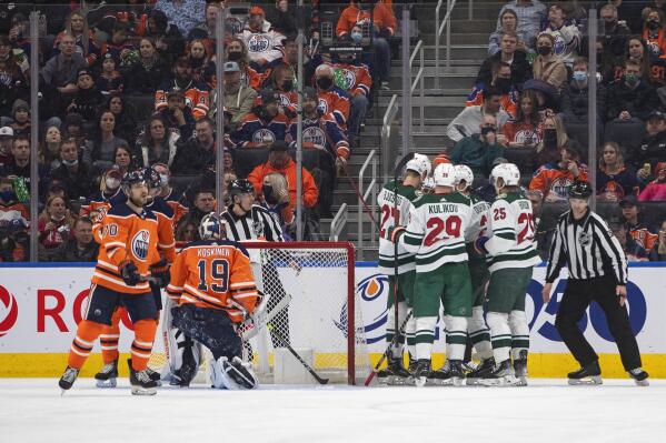 Minnesota Wild players celebrate a goal against the Edmonton Oilers during second-period NHL hockey game action in Edmonton, Alberta, Sunday, Feb. 20, 2022. (Jason Franson/The Canadian Press via AP)