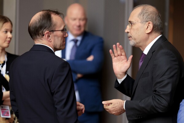 Norway's Foreign Minister Espen Barth Eide, left, speaks with Jordan's Minister of Foreign Affairs Ayman Safadi during a meeting at the European Council building in Brussels, Monday, May 27, 2024. Ministers meet Monday for the eighth Brussels Conference on 