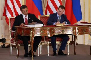 FILE - President Barack Obama, left, and Russian President Dmitry Medvedev sign the New START treaty at the Prague Castle in Prague on April 8, 2010. NATO called on Russia on Friday, Feb. 3, 2023, to respect the only treaty it has with the United States aimed at keeping a lid on nuclear weapons expansion and urged Moscow to allow on-the-ground inspections of military sites to resume. (AP Photo/Alex Brandon, File)