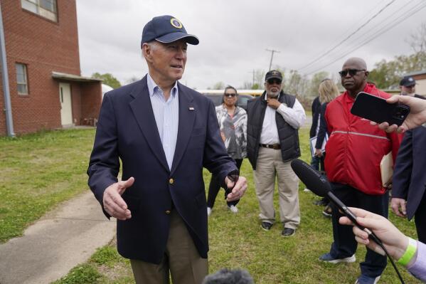 President Joe Biden speaks with members of the media after a briefing in Rolling Fork, Miss., Friday, March 31, 2023. Biden traveled to Rolling Fork to survey the damage after a deadly tornado and severe storm moved through the area. Housing and Urban Development Secretary Marcia Fudge, Rep. Bennie Thompson, D-Miss., and Rolling Fork Mayor Eldridge Walker look on. (AP Photo/Carolyn Kaster)