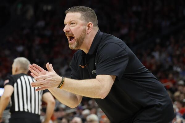 Texas head coach Chris Beard reacts during the first half of a first round NCAA college basketball tournament game against Virginia Tech Friday, March 18, 2022, in Milwaukee. (AP Photo/Jeffrey Phelps)