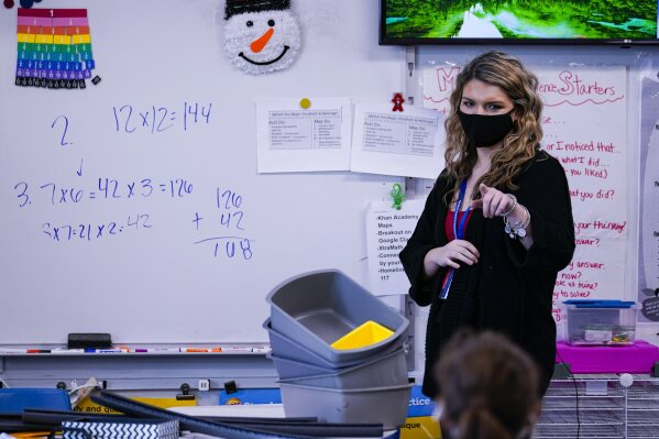 Grace Kern, a substitute teacher at the Greenfield Intermediate School in Greenfield, Ind., is photographed Thursday, Dec. 10, 2020. Kern, astudent at IUPUI in Indianapolis, is one of several college students being recruited to work as substitute teachers in schools during the pandemic. (AP Photo/Michael Conroy)