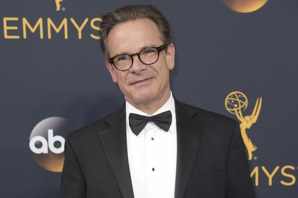 FILE - Peter Scolari arrives at the 68th Primetime Emmy Awards in Los Angeles on Sept. 18, 2016. Scolari, a versatile character actor whose television roles included a yuppie producer on “Newhart” and a closeted dad on “Girls” and who was on Broadway in “Hairspray” and “Wicked,” died Friday morning in New York after fighting cancer for two years, according to Ellen Lubin Sanitsky, his longtime manager. He was 66. (Photo by Richard Shotwell/Invision/AP, File)
