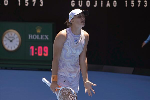 Iga Swiatek of Poland reacts as she plays against Elena Rybakina of Kazakhstan during their fourth round match at the Australian Open tennis championship in Melbourne, Australia, Sunday, Jan. 22, 2023. (AP Photo/Mark Baker)
