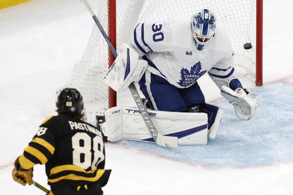 Boston Bruins' David Pastrnak (88) scores on Toronto Maple Leafs' Matt Murray (30) during the second period of an NHL hockey game Saturday, Jan. 14 2023, in Boston. (AP Photo/Michael Dwyer)