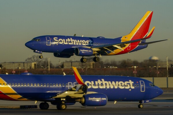 FILE - Southwest Airlines plane prepares to land at Midway International Airport, Feb. 12, 2023, in Chicago. A judge has sanctioned Southwest Airlines on Monday, Aug. 7, writing that the airline twisted his words and disregarded his order in the case of a flight attendant who claimed that she was fired for expressing her opposition to abortion. U.S. District Judge Brantley Starr said Southwest acted as if its own policy limiting what employees can say is more important than a federal law protecting religious speech. (AP Photo/Kiichiro Sato, File)