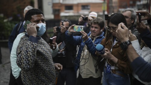 Manuel Ranoque, father of two of the youngest Indigenous children who survived an Amazon plane crash that killed three adults, and then braved the jungle for 40 days before being found alive, speaks to the media from the entrance of the military hospital where the children are receiving medical attention, in Bogota, Colombia, Sunday, June 11, 2023. (AP Photo/Ivan Valencia)