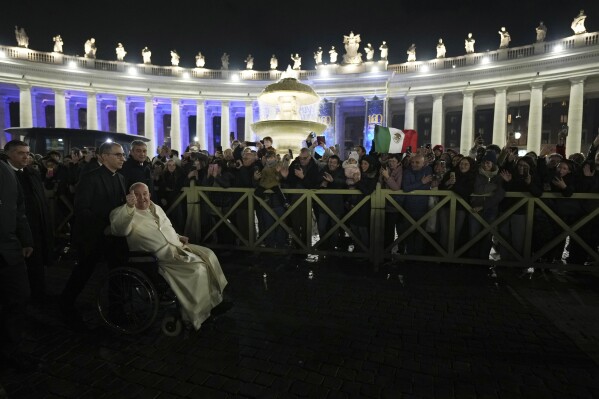 Pope Francis waves faithfuls after celebrating over New Year's Eve Vespers and Te Deum, in St.Peter's Basilica at the Vatican, Dec. 31, 2024. (AP Photo/Andrew Medichini)